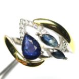 A 925 silver gilt ring set with pear and marquise cut sapphire and white stones, (N.5).