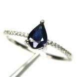 A 925 silver ring set with a pear cut sapphire, (R).