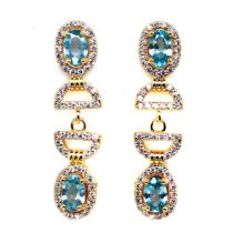 A pair of gold on 925 silver drop earrings set with oval cut seafoam blue topaz and white stones, L.