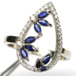 A 925 silver ring set with marquise cut sapphires and white stones, (O).