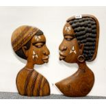 Two African inlaid wall mounted torsos, H. 49cm.