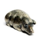 A Russian 88 silver model of a pig with ruby eyes, L. 6cm.