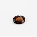 An unmounted natural oval cut garnet, approx. 3.74ct.