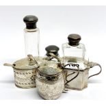 Two heavy hallmarked silver mustard pots and liners, largest L. 11cm, together with a white metal (