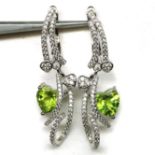 A pair of 925 silver drop earrings set with heart cut peridots and white stones, L. 3.5cm.