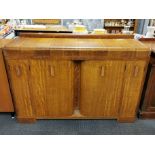 A light oak drinks cabinet/ sideboard, 145 x 50 x 98cm.