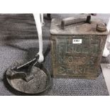 A vintage Flight Motor Spirit petrol can and a cast iron boot scraper.