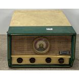 A vintage Dansette portable record player and radio tuner, 41 x 46 x 26cm.