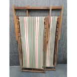 A pair of vintage folding deck chairs, unfolded 138 x 60cm.
