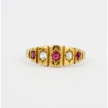 An antique hallmarked 15ct yellow gold ring set with fancy cut rubies and old cut diamonds, (N).