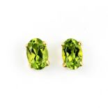 A pair of 18ct yellow gold (stamped 18K) peridot set stud earrings, L. 0.7cm.