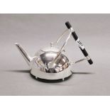A Christopher Dresser style tea pot, spout to handle, 27cm, H. 17cm.