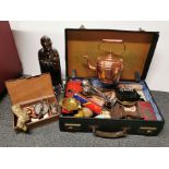 A vintage suitcase of interesting mixed items.