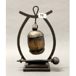 A handmade wrought iron cowbell style dinner gong, H. 31cm.