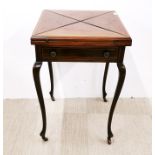 A single drawer inlaid mahogany fold out games table on castors, H. 78cm. Top detached.