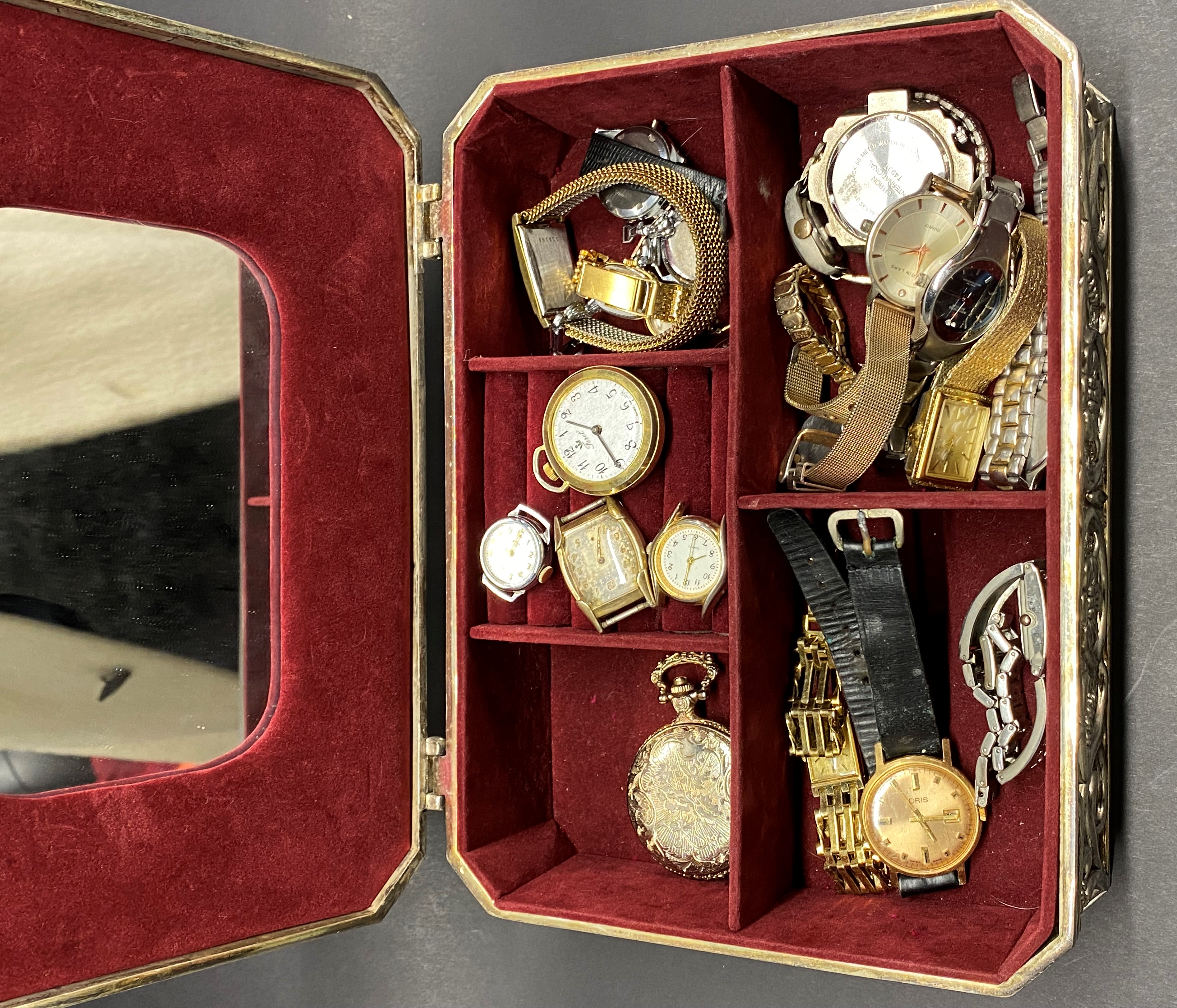 A silver plated box and watch contents.