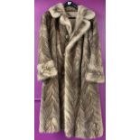 A vintage ladies silver fox fur coat.