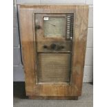 A vintage floor standing oak cased Ekco radio, 95 x 57cm.