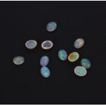 A quantity of unmounted natural opals, approx. 10.71ct total.