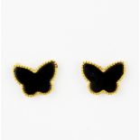 A pair of 18ct yellow gold (stamped 750) onyx set butterfly shaped stud earrings, L. 0.5cm. With