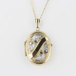 A 9ct yellow and white gold locket pendant and chain, L. 50cm.