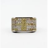 A 925 silver ring set with yellow and white cubic zirconias, (O). One stone missing.