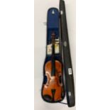 A cased three quarter size violin, L. 57cm.