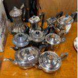 A qauntity of silver plated tea and coffee pots.