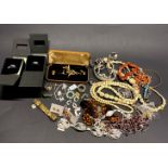 A box of mixed costume jewellery.