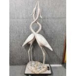 An impressive antique lead garden sculpture of two cranes with intertwined necks in a Chinese style,