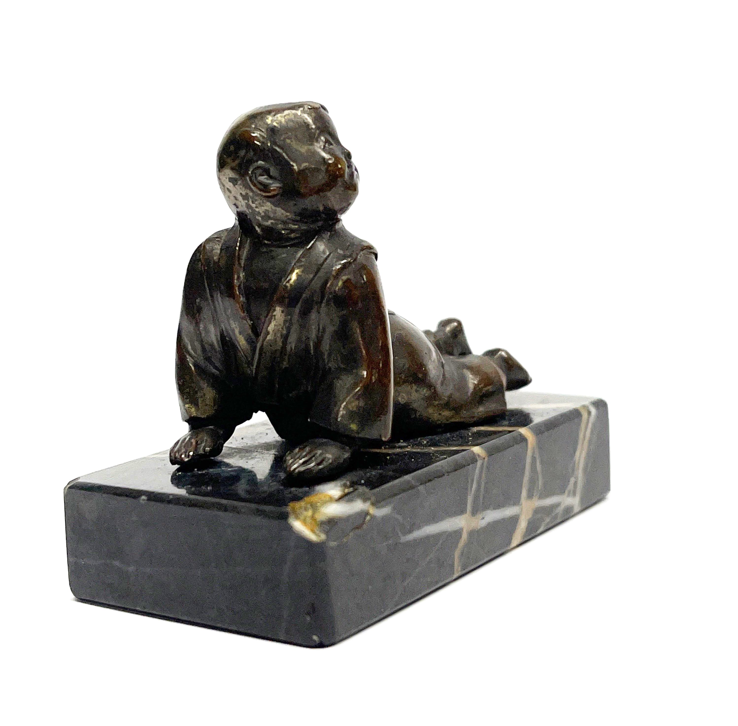 A small early 20th century Japanese bronze figure of a boy on a marble base, L. 6cm, H. 5cm. - Image 2 of 2