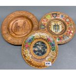 Three mid 20th century carved and painted wooden plates, largest Dia. 28cm.