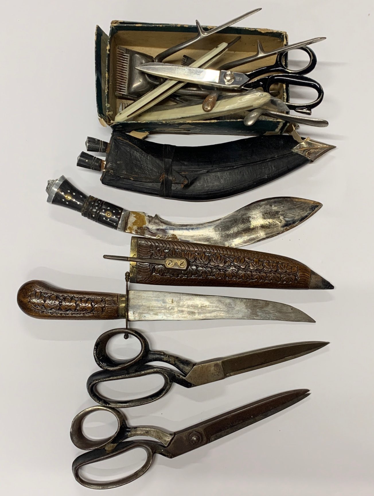 A Collection of vintage scissors, hairdressing items and two further knives.