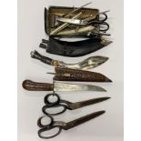 A Collection of vintage scissors, hairdressing items and two further knives.