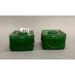 An interesting pair of Chinese green glass candlesticks imitating jade, 9 x 9 x 9.5cm.