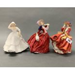 A group of three Royal Doulton porcelain figurines, 'Samantha, Top o' the hill' and 'Autumn