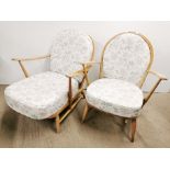 Two light elm Ercol 'Windsor' chairs with spindle backs, largest H. 80cm W. 71cm.