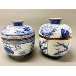 Two Korean finely decorated and brass mounted porcelain bowls and covers, tallest H. 23cm.