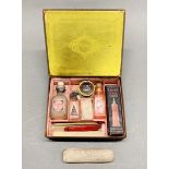 A 1920's Cutex manicure box and contents, 15 x 12.5 x 4.5cm.