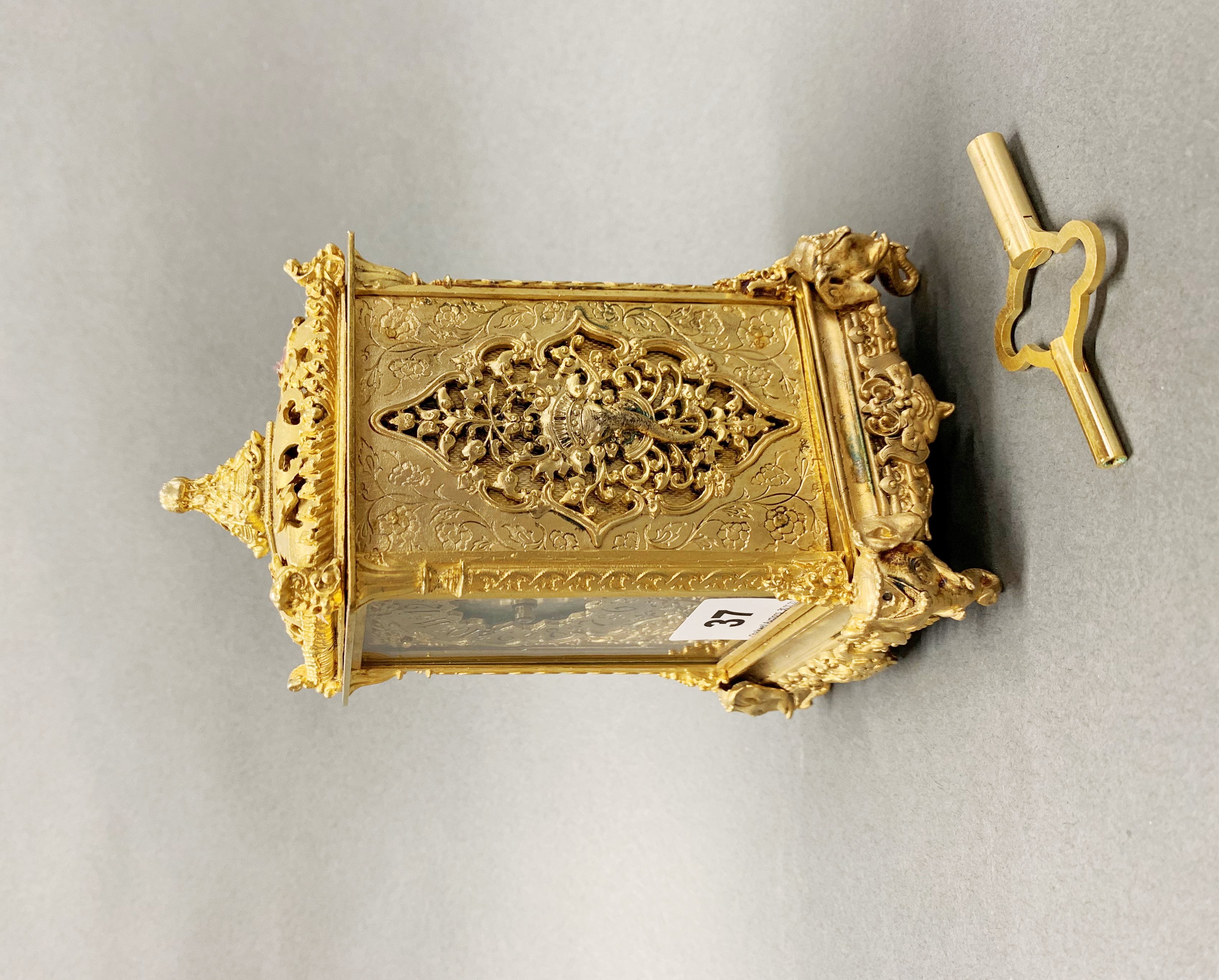 A lovely gilt bronze and mother of pearl dial mantel clock, with elephant head decoration, H. 18cm. - Image 2 of 3