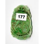 A large Chinese carved jade amulet of young dragons with lotus and peach, 11 x 8 x 1.5cm.