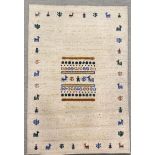 An Eastern cream ground rug with splattered yellow decoration, 170 x 120cm. Together with a