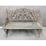 An antique cast iron and wooden panelled garden bench, L. 122cm, H. 83cm.