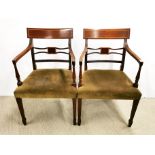 A pair of early 20th century inlaid mahogany carver chairs, H. 87cm. Some damage to upholstery.