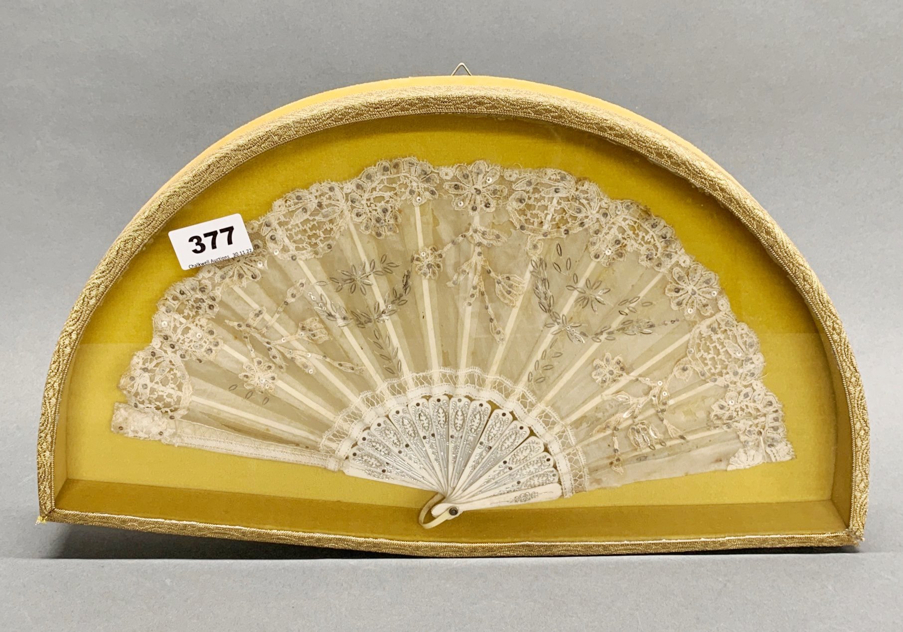 A French framed fan, W. 37cm.