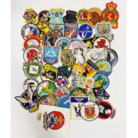 A quantity of embroidered travel badges.