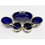 A hallmarked silver (Birmingham circa 1924) blue glass lined caviar dish, W. 13.5cm, with two