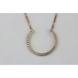 A hallmarked 9ct yellow gold necklace set with brilliant cut diamonds, L. 50cm.