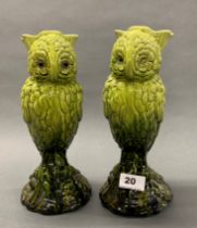 A pair of English green glazed pottery owl vases, H. 26cm, one with glass eyes, registered number
