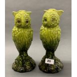 A pair of English green glazed pottery owl vases, H. 26cm, one with glass eyes, registered number